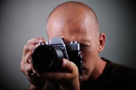 Closeup of a photographer with cameraの写真素材
