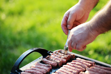 Flames grilling a steak on the BBQ