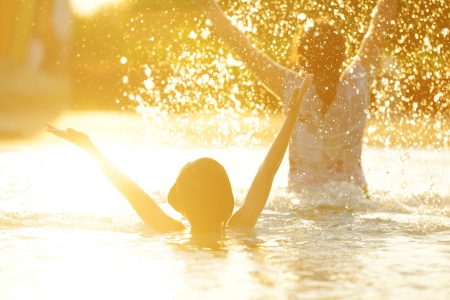 Happy children playing on hot summertimeの写真素材