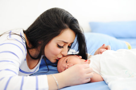 Happy mother with her baby