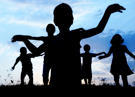Happy children playing on hot summertimeの写真素材