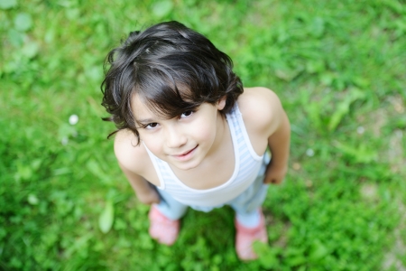 Closeup portrait of a little happy boy outsideの写真素材