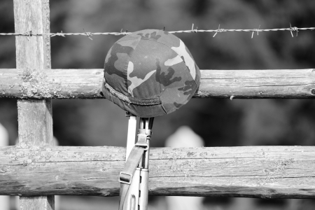 Military rifle and helmetの写真素材