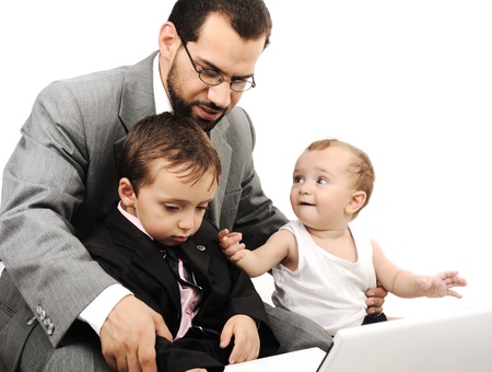 Young father and two kids with laptopの写真素材