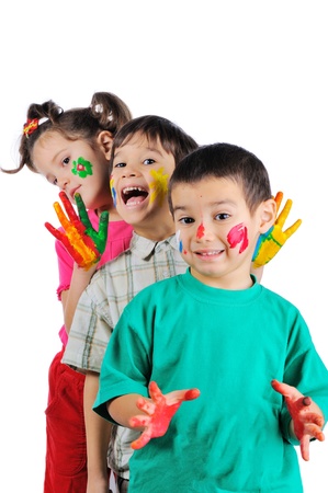 Thre beautiful painted kids standing in a row one after anotherの写真素材