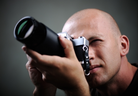 Closeup of a photographer with cameraの写真素材