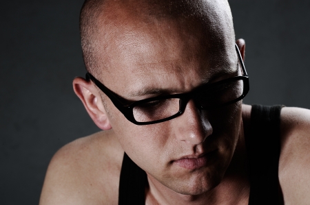 Portrait of a serious guy wearing glassesの写真素材