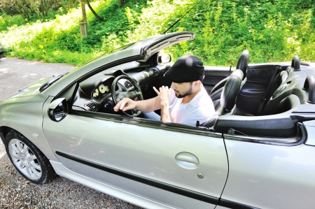 Young man in luxury sports carの写真素材