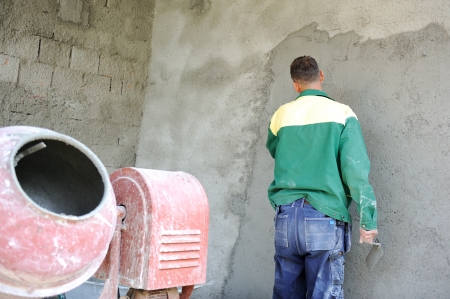 Construction worker doing his job with agitatorの写真素材