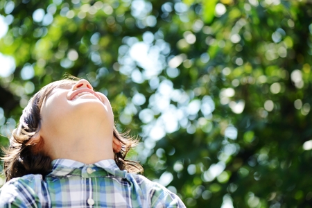 Portrait of a cute kid outdoorの写真素材