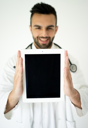 Attractive modern doctor with tabletの写真素材