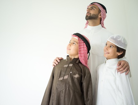 Arabic young father posing with kidsの写真素材