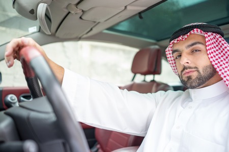 Arabic young businessman driving carの写真素材