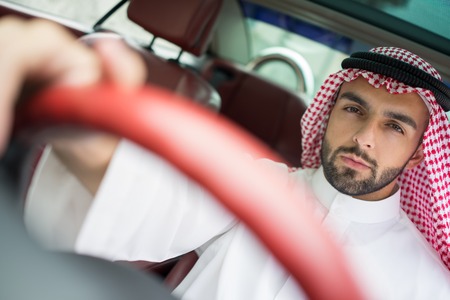 Arabic young businessman driving carの写真素材