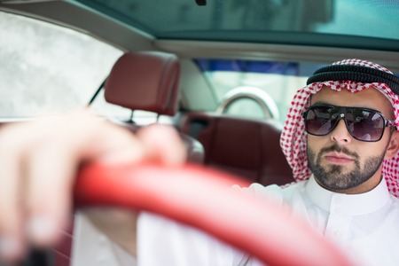 Arabic young businessman driving carの写真素材