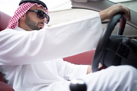 Arabic young businessman driving carの写真素材