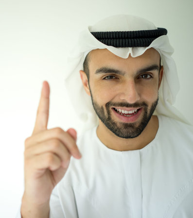 Arabic young businessman posing with finger upの写真素材