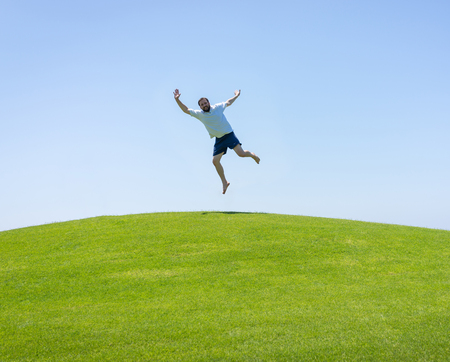 Happy summer vacation for kids on green meadow near seaの写真素材