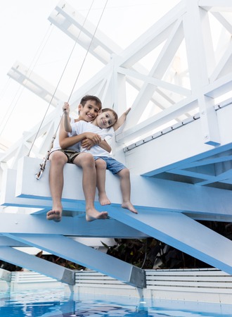 Happy kids spending holiday vacation in beautiful resortの写真素材