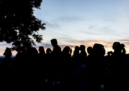 Crowd people together outdoor waiting for sunsetの写真素材