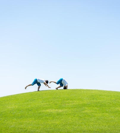 Kid jumping on beautiful fieldの写真素材