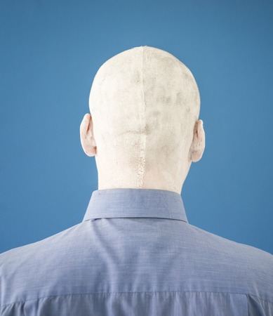 Artistic painting man face in whiteの写真素材