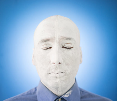 Artistic painting man face in whiteの写真素材
