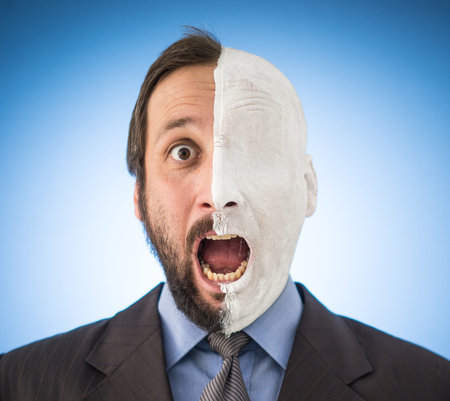 Conceptual two sides face portait photo of a businessman