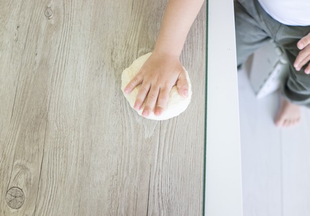 Little kid at home making foodの写真素材