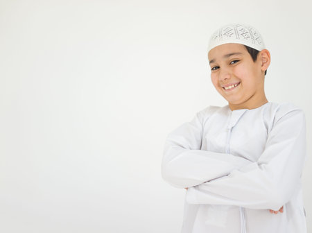 Excited cute Arabic little boy smilingの写真素材