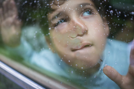 Happy kids travel by the car and making funny grimaceの写真素材