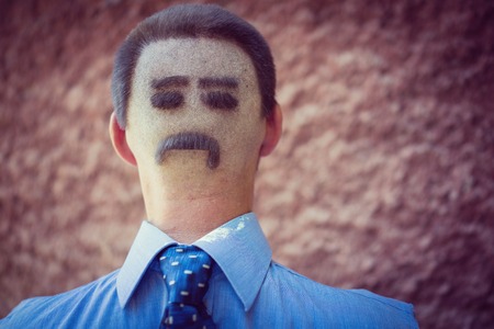 Man closeup portrait funny made on his back of head hairの写真素材