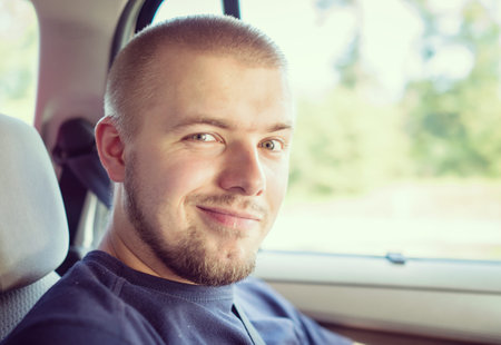 Young handsome man in the carの写真素材