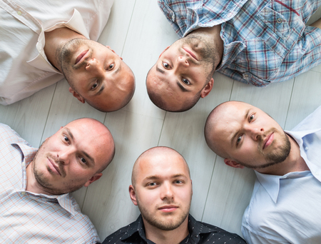 Young men closeup group portraitの写真素材