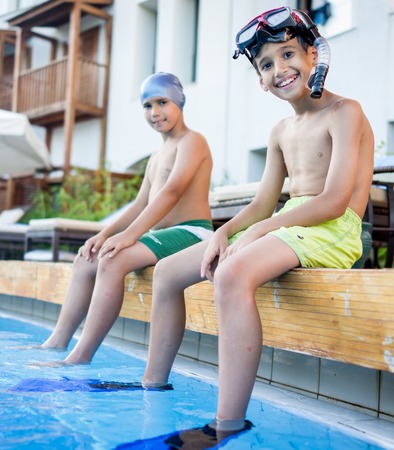 Happy kid on summer swimming pool vacation having fun and happy life timeの写真素材