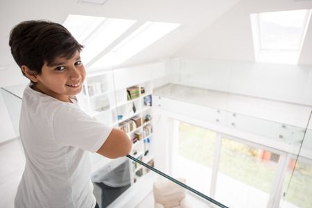 Cute boy in new modern property home interiorの写真素材