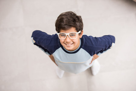 Cute kids posing from above angle on ground