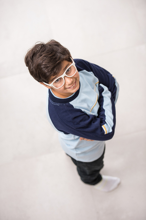 Cute kids posing from above angle on groundの写真素材