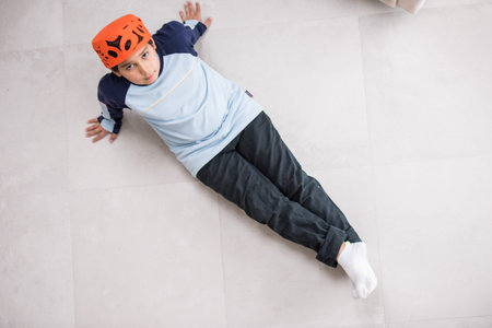 Cute kids posing from above angle on groundの写真素材