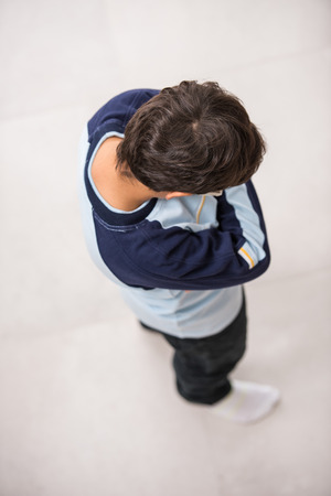 Cute kids posing from above angle on groundの写真素材