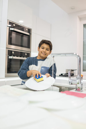 Child in modern white kitchenの写真素材