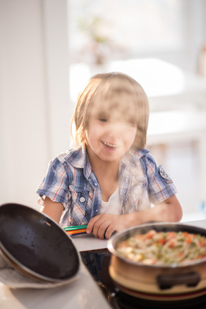 Cute adorable little boy in the kitchenの写真素材