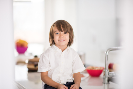 Cute adorable little boy in the kitchenの写真素材