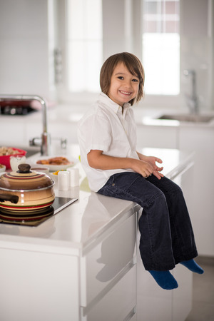 Cute adorable little boy in the kitchenの写真素材