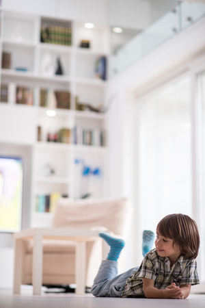 Cute little child at beautiful modern homeの写真素材
