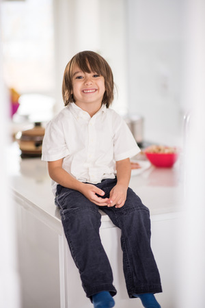 Cute adorable little boy in the kitchenの写真素材