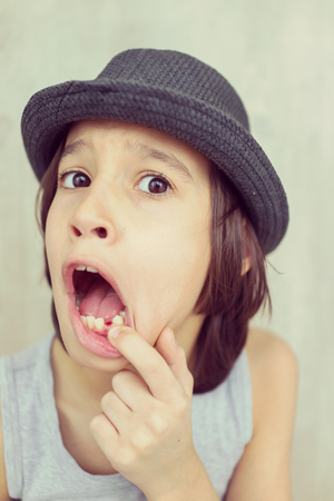 Portrait of child with tooth outの写真素材