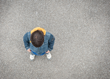 Jumping running kid on the streetの写真素材