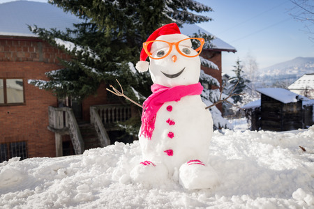 Snowman on snow backgroundの写真素材