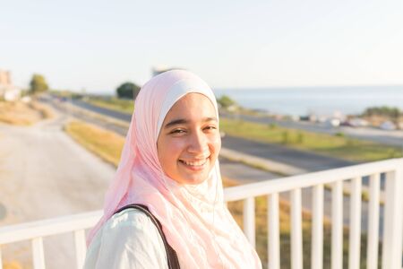 Muslim girl on sea coastの写真素材